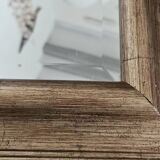 Beveled mirror under gold frame