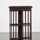 Wooden bookstand with green leather surface and on wheels in English style