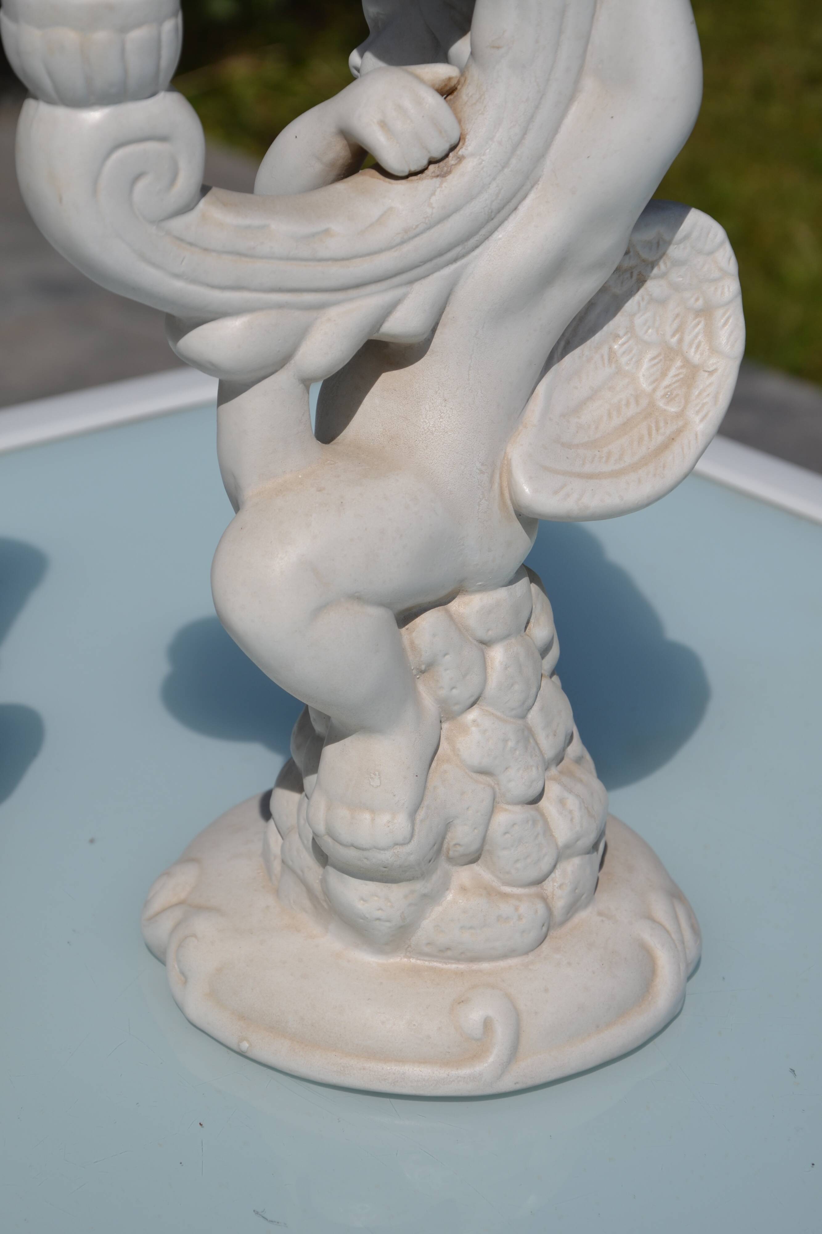 Pair of "cherub" candle holders in plaster