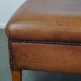 English-style leather ottoman in cognac-colored leather