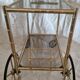Rolling dessert trolley in gilded brass & glass from the 1970s in the style of Maison Jansen.