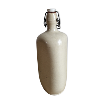 Old bottle of beige sandstone hot water bottle