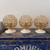 Trio of golden globe wall or ceiling lights