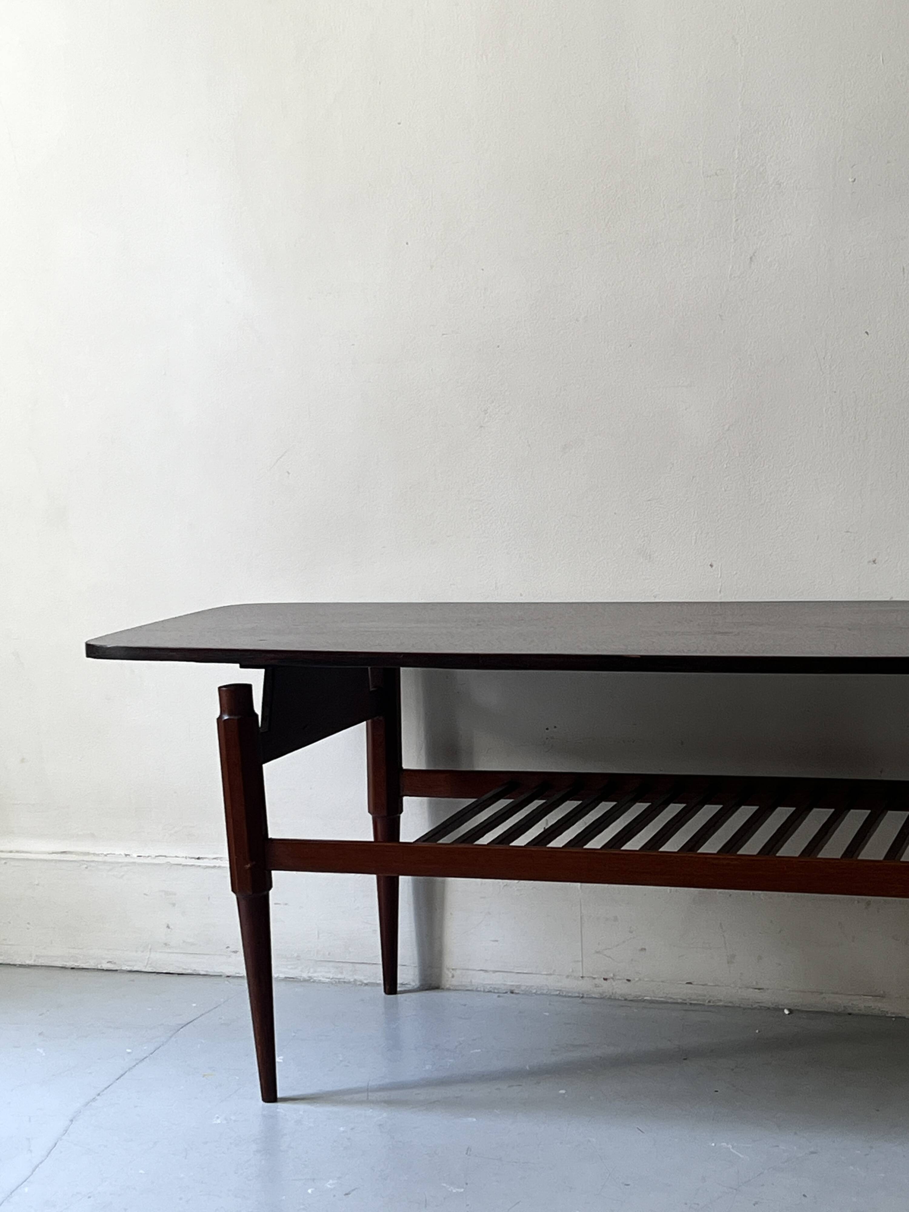 Danish teak coffee table with a double top, 1950s design.