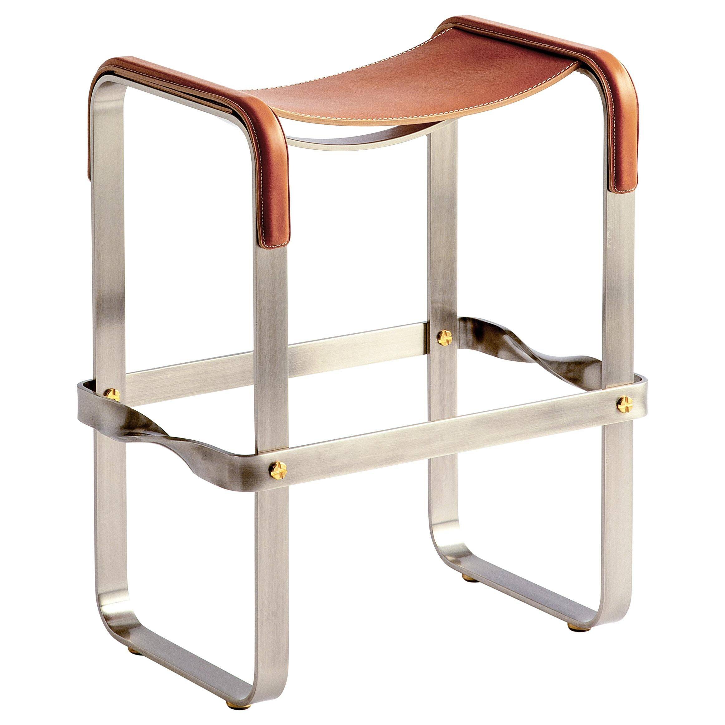 Contemporary bar stool in aged silver steel and natural tobacco leather.