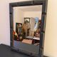 Patinated black rectangular wooden mirror