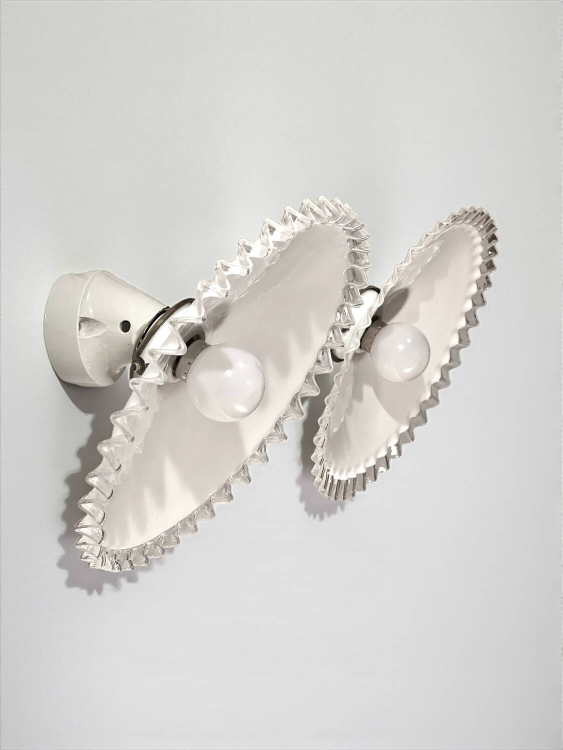 Pair of Art Deco wall sconces in scalloped opaline glass and porcelain