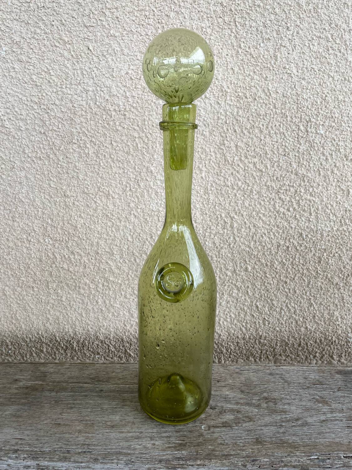 70s biot glass bottle