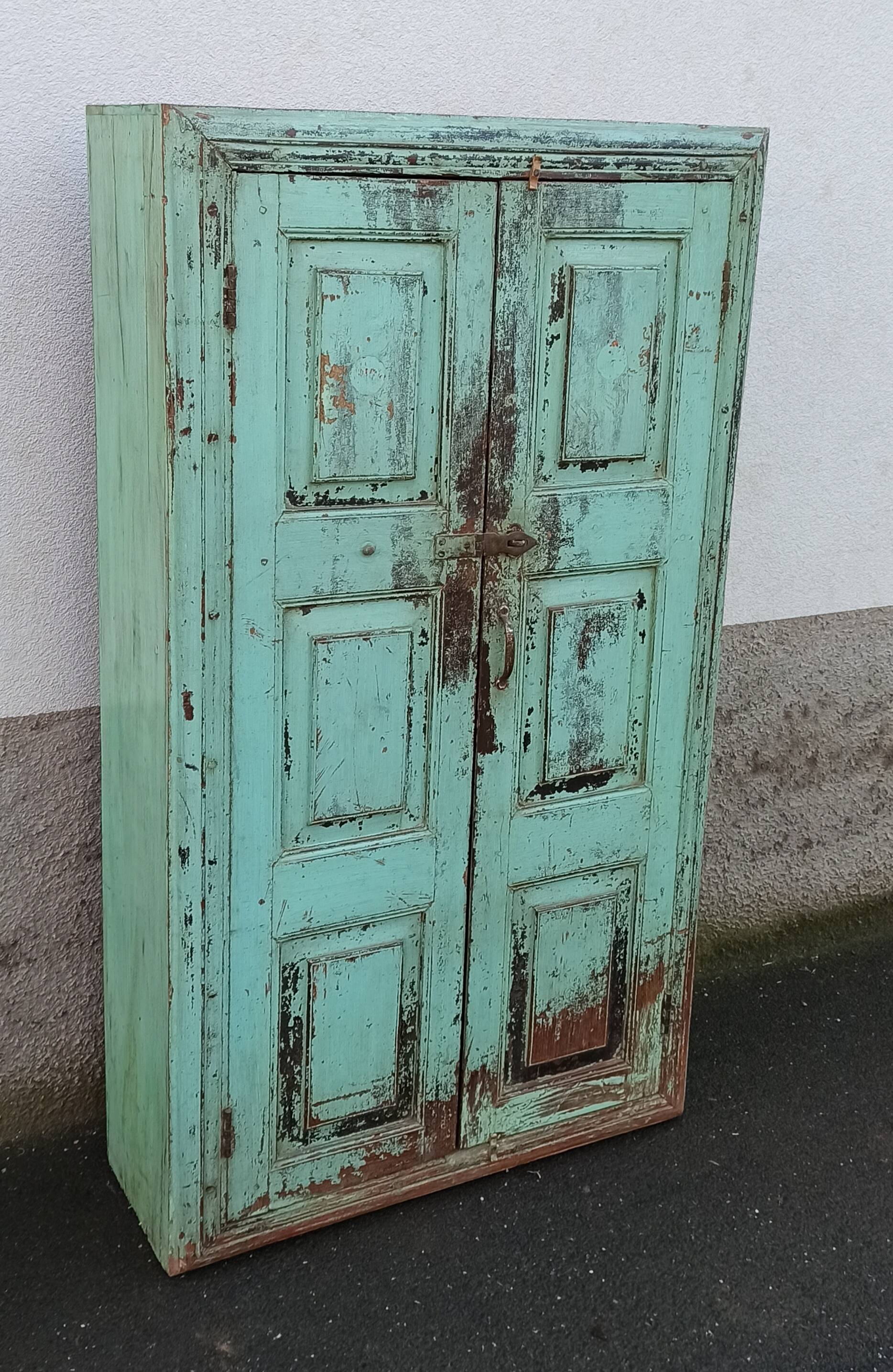 Old wooden cabinet with beautiful green patina