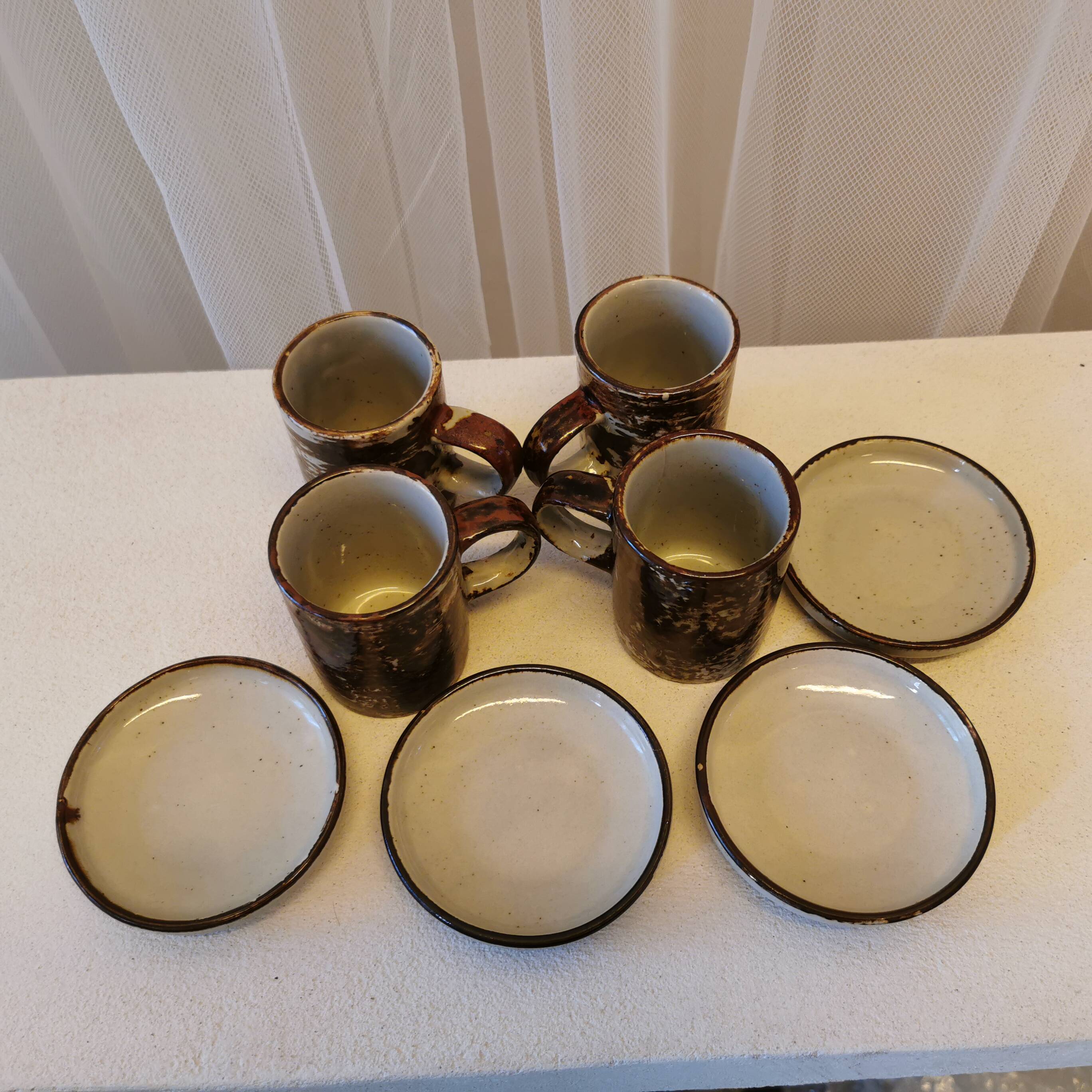 Set of 4 coffee cups and saucers