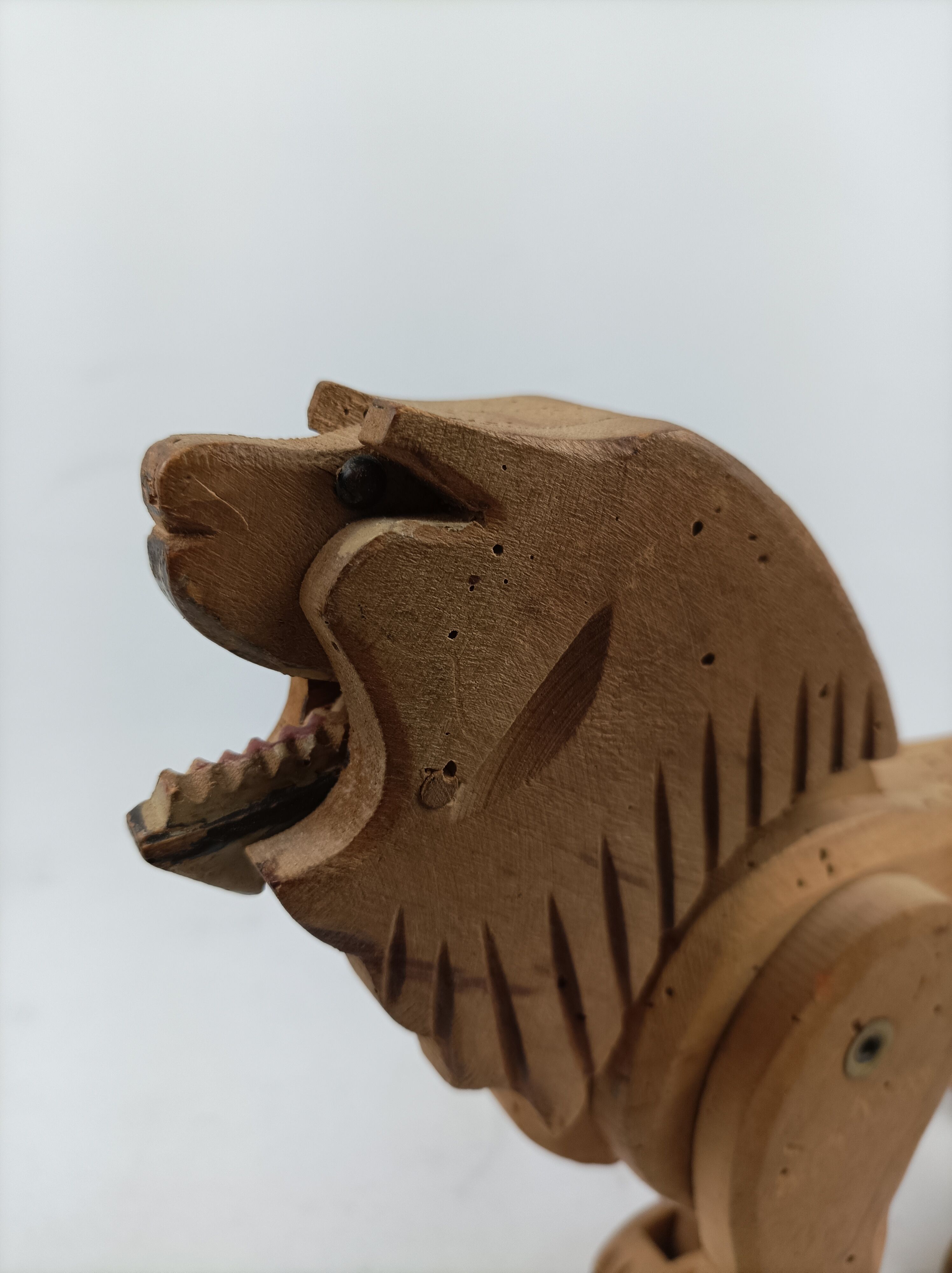 Articulated wooden lion