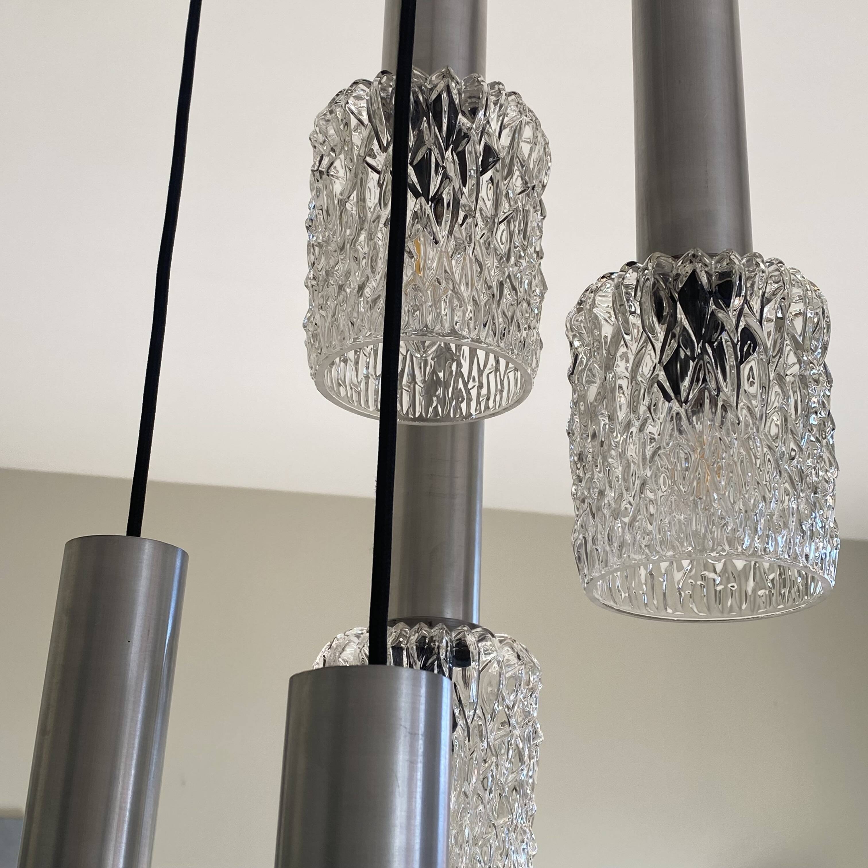 Large suspension chandelier with 5 glass lampshades and aluminium tube.