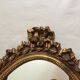 Miroir ovale en bois doré 52 x 35 cm