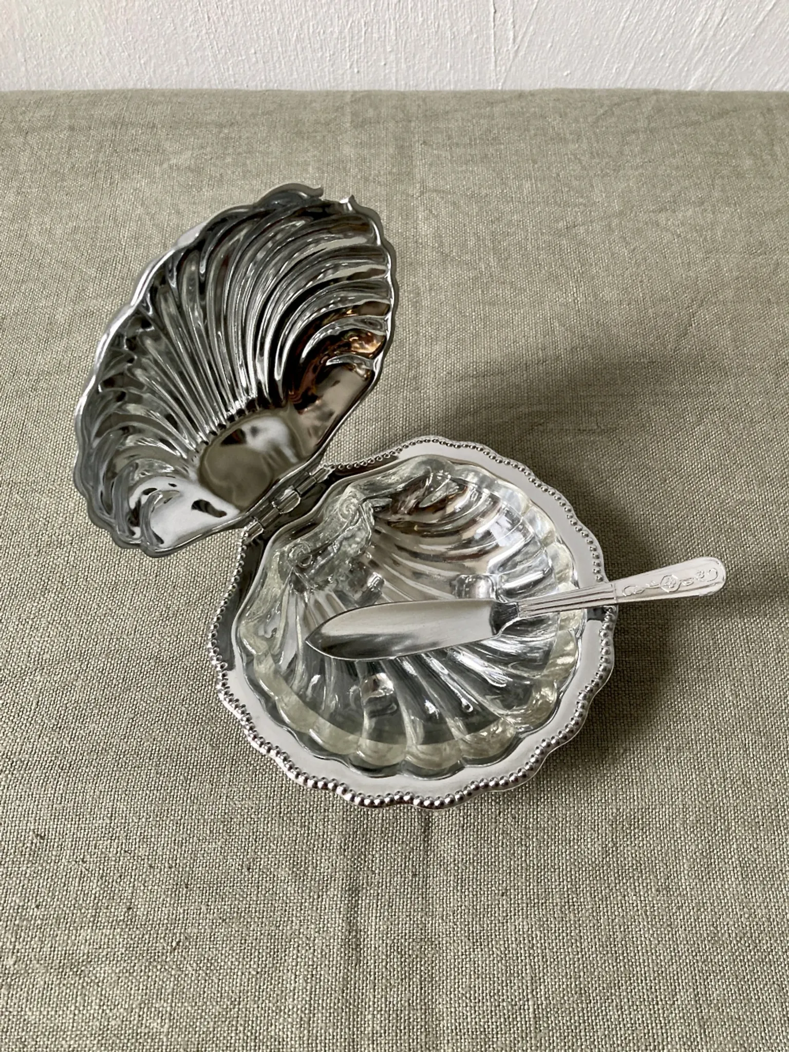 Metal shell butter dish with glass bowl and knife