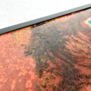 Coffee table by Robert and Jean Cloutier in enamelled lava and metal, 1950s.