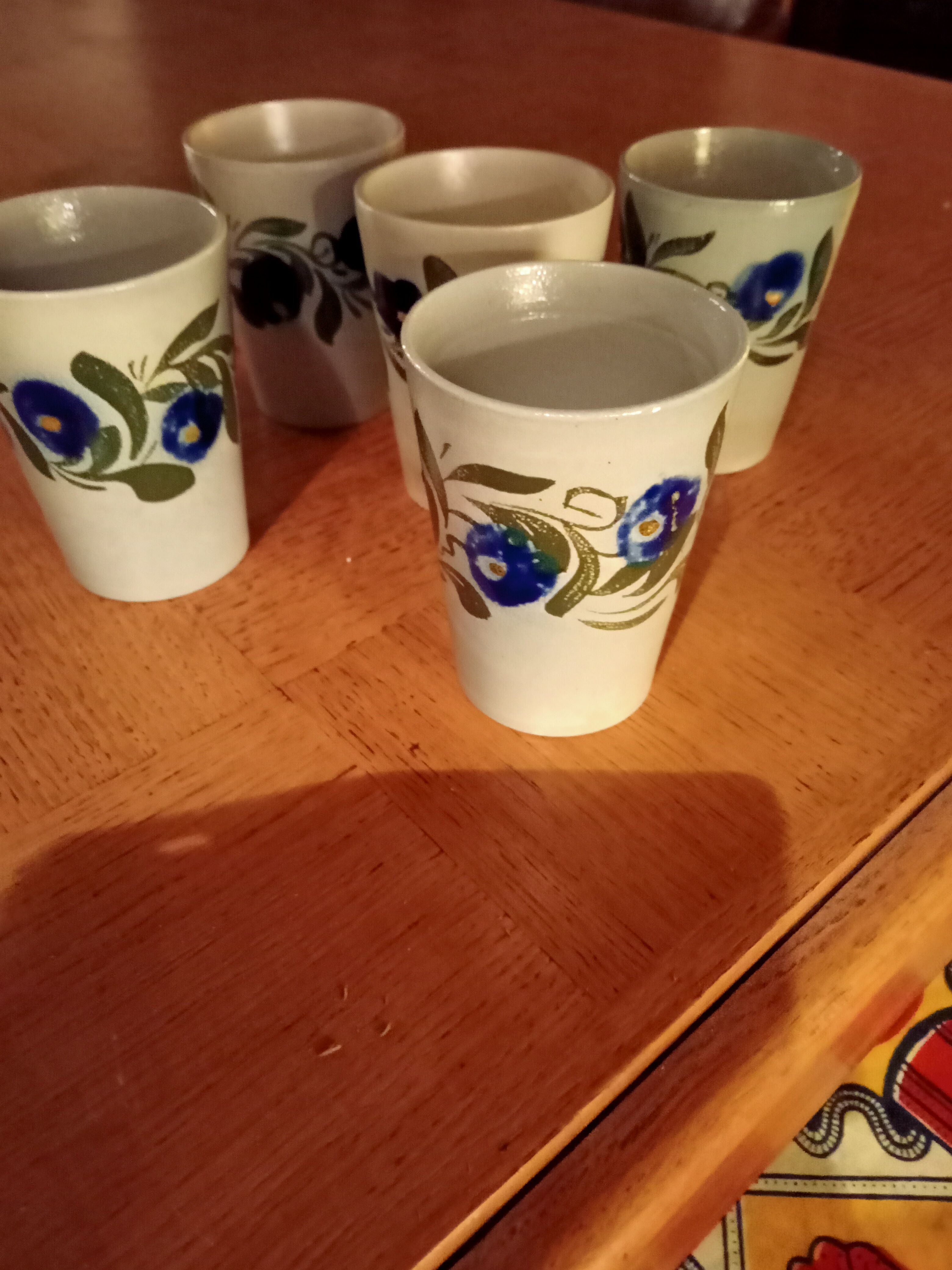 Set of five sandstone mugs