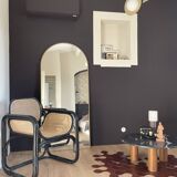 Black armchair with cane and natural rattan
