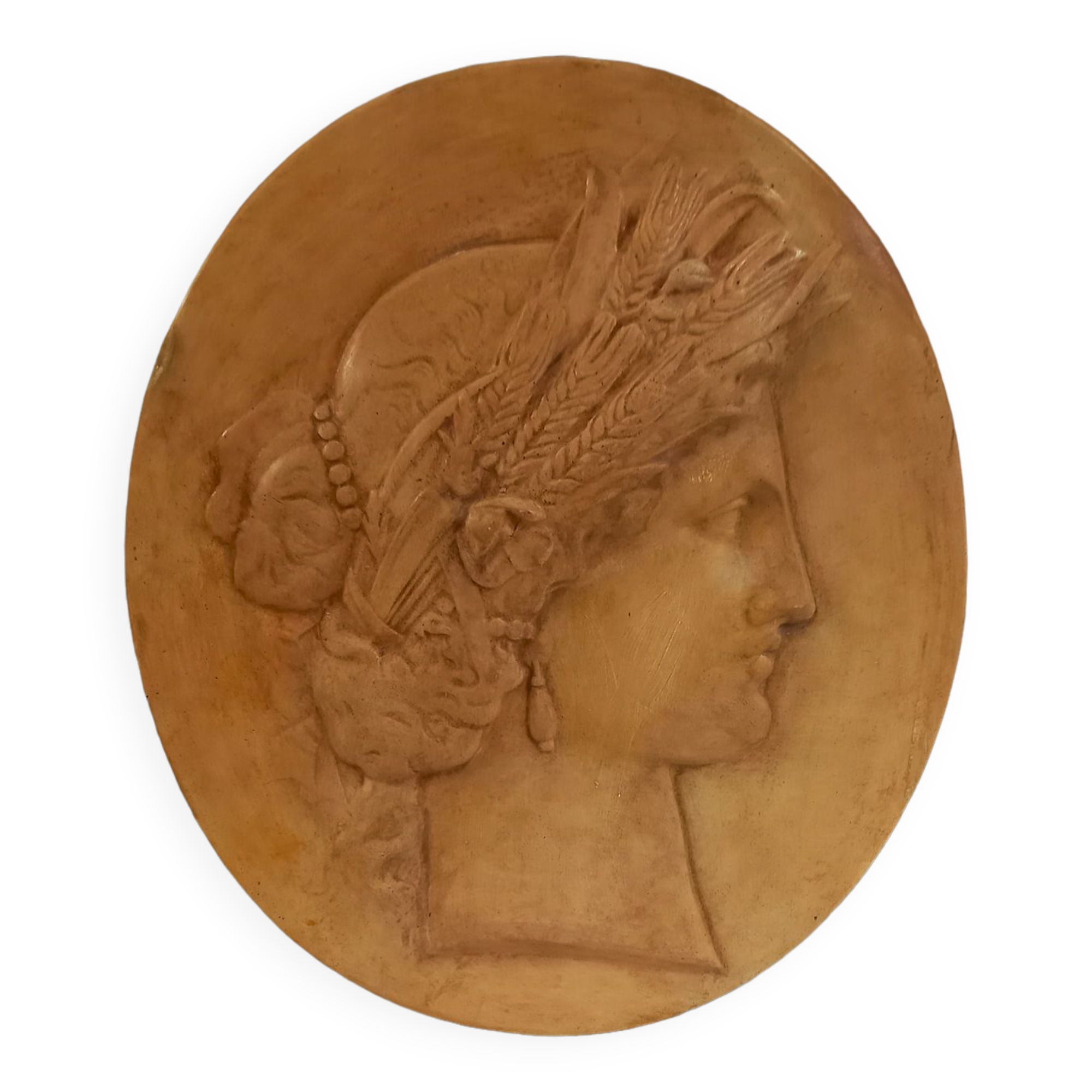 Plaster medallion, high relief, yellow ochre patina, representing the Roman divinity Ceres