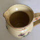Old ceramic jug with floral decoration