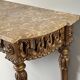 Louis XVI style console in carved wood with a gilded patina, 19th century.