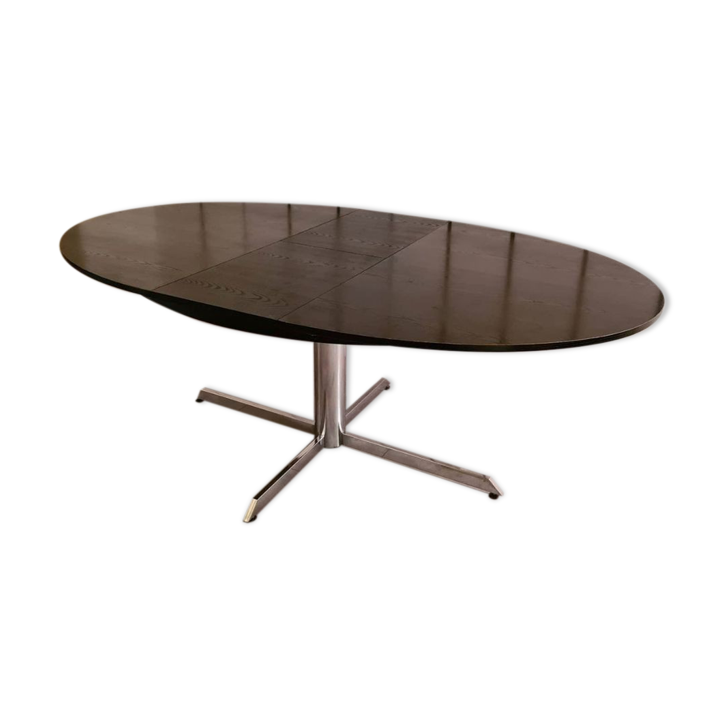 Blackened wooden dining table and chrome foot with integrated butterfly extension