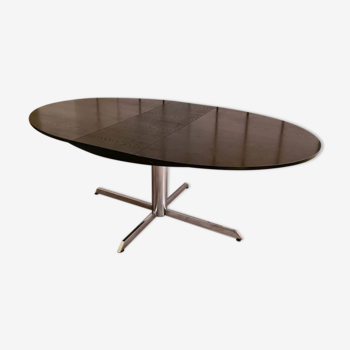 Blackened wooden dining table and chrome foot with integrated butterfly extension