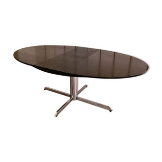 Blackened wooden dining table and chrome foot with integrated butterfly extension