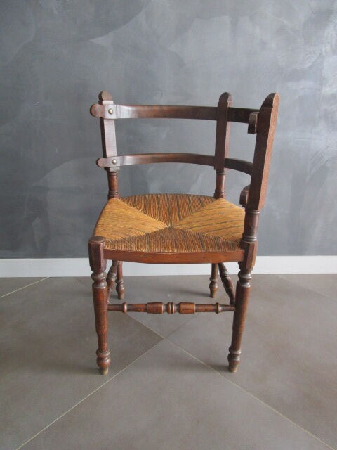 Old straw corner armchair