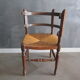 Old straw corner armchair