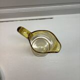 Decorated yellow glass pitcher