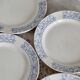 4 vintage porcelain dessert plates with blue border