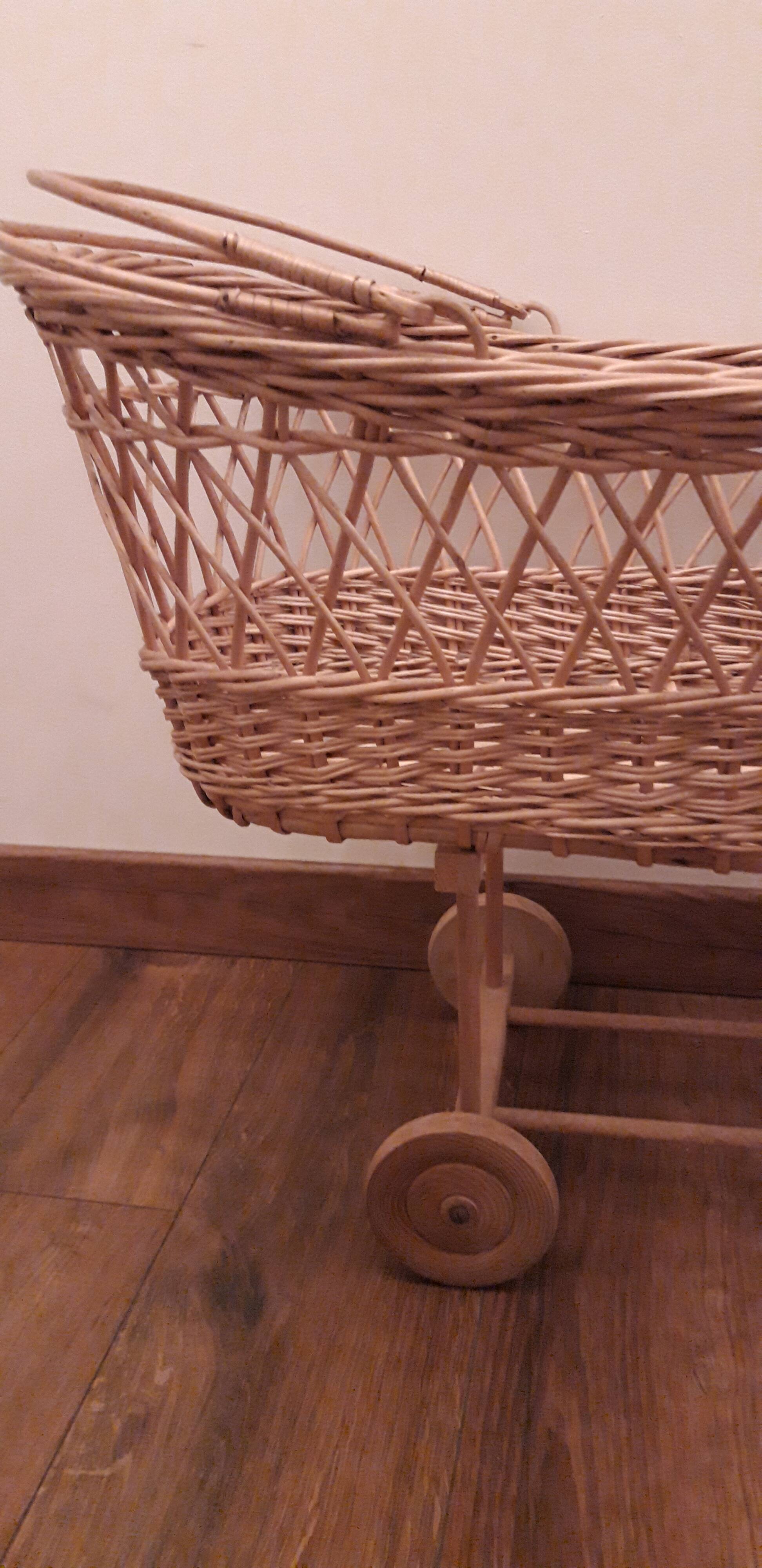 Vintage wicker cradle with wheels