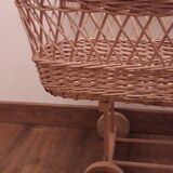 Vintage wicker cradle with wheels