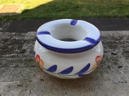 Small ceramic ashtray in two parts. Like new