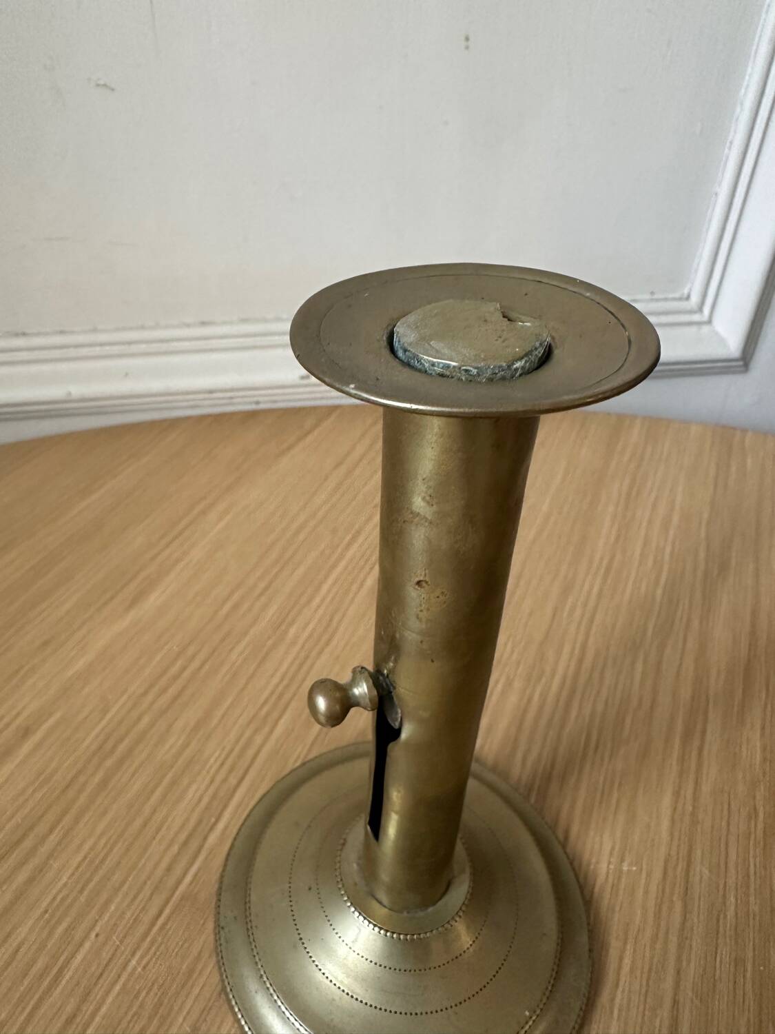 Old brass pull candle holder