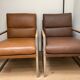 A pair genuine leather armchairs.