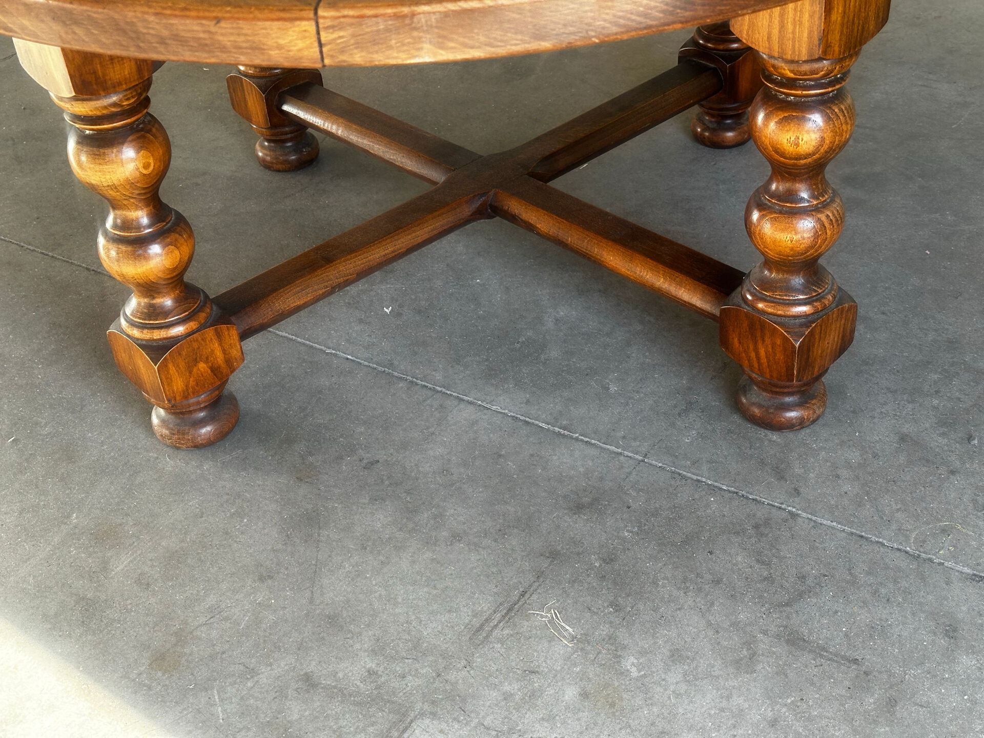 Vintage coffee table in turned wood and leather with astrological decoration.