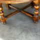Vintage coffee table in turned wood and leather with astrological decoration.