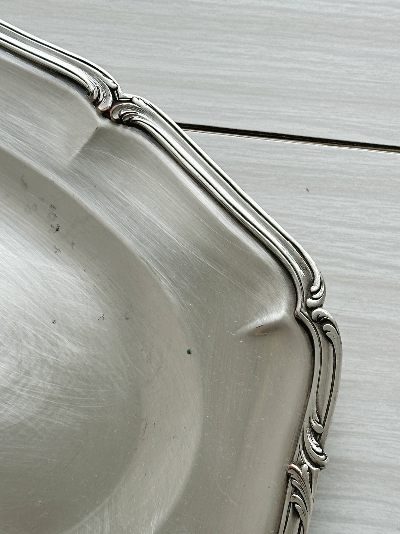 oval silver metal plate