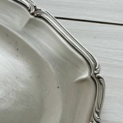 oval silver metal plate