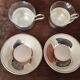 Set of 2 metal cups and saucers