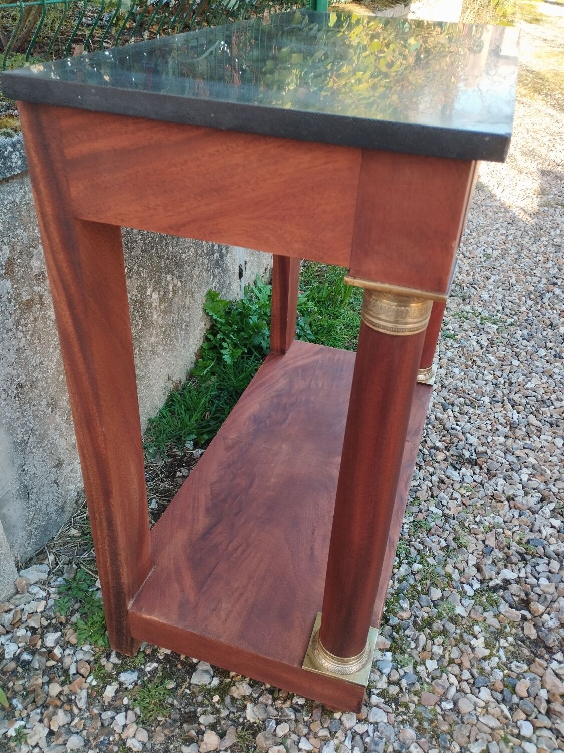 Console in old Empire style with a wooden frame and marble top.