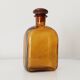 Vintage amber glass apothecary bottle