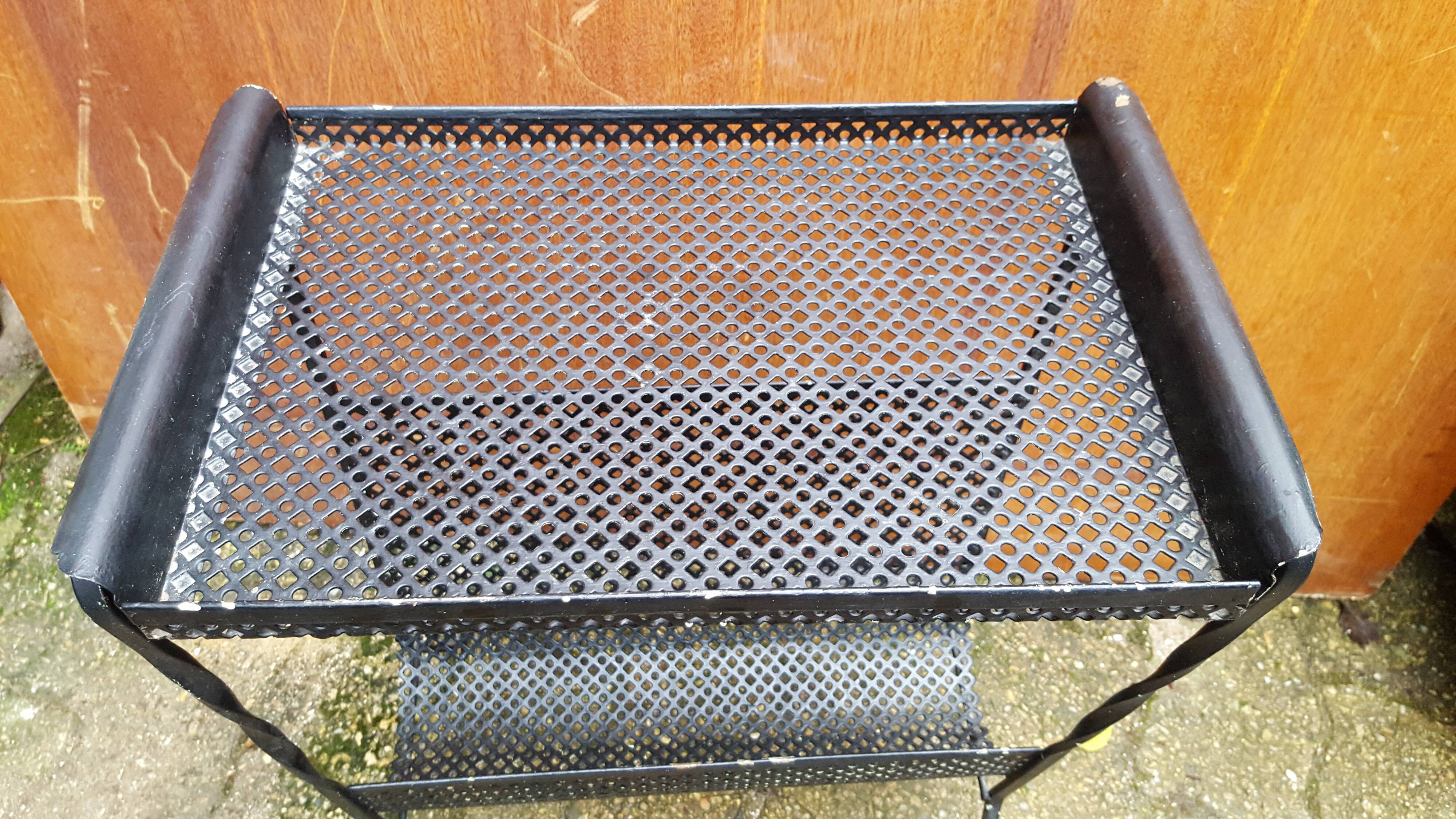 Perforated metal magazine holder design 50