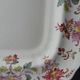 Antique Longchamp serving platter with polychrome daisies in ironstone.