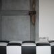 Roche Bobois black and white checkered leather bench, low bench.