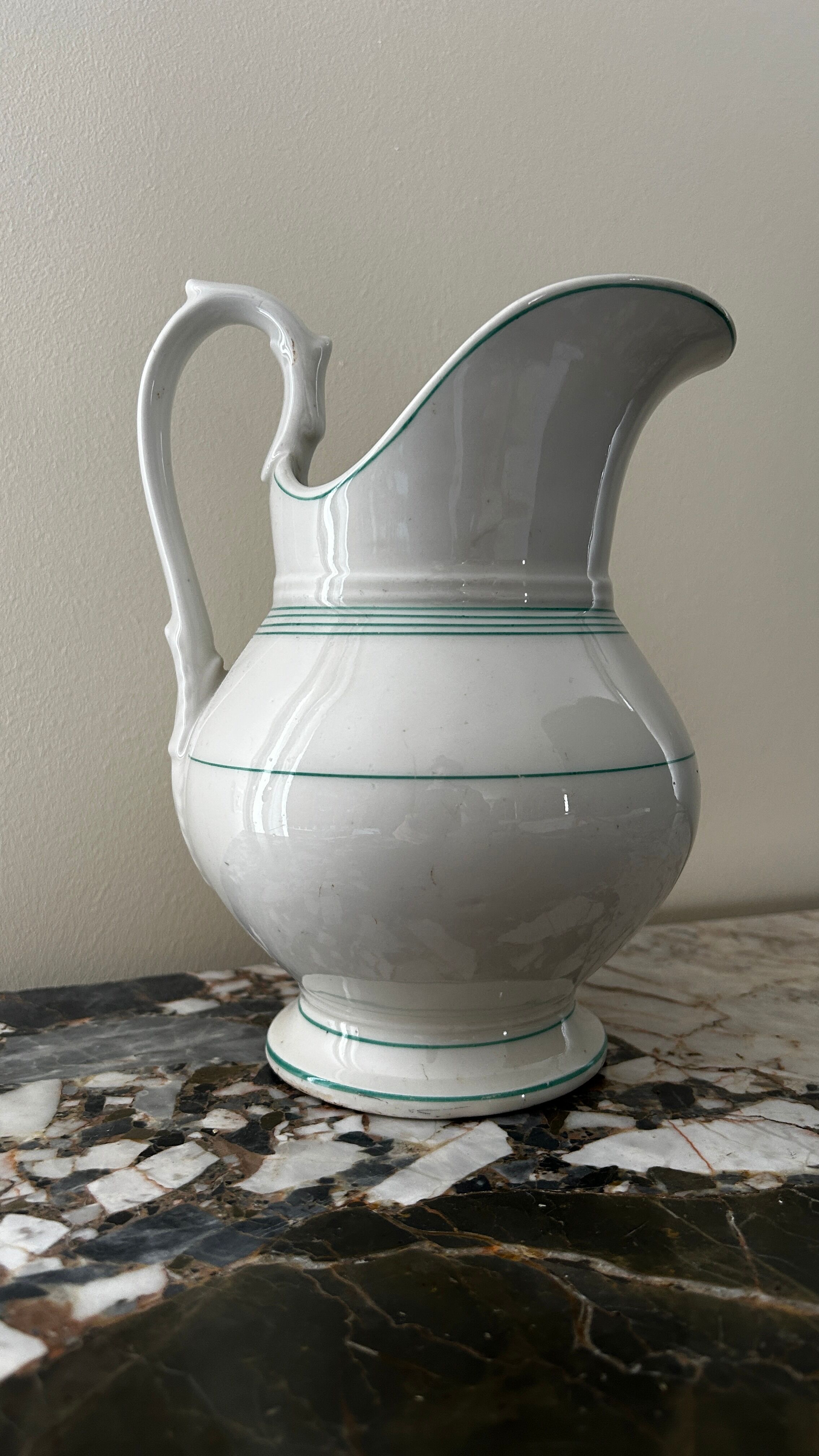 White toilet jug with green trim