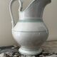 White toilet jug with green trim