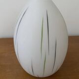 White opaline tulip with dark green and gray streaks. Oblong shape.