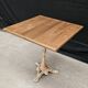 Bistro table with cast iron base and solid teak top